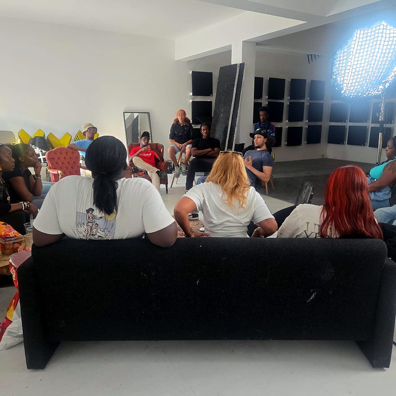 Young people sitting together in a circle during an Express Yourself session