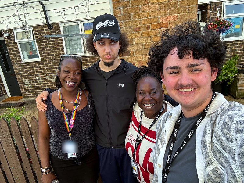 Photo 51 and partner staff on outreach with a young person